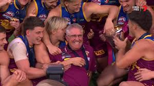 Brisbane is presented the premiership cup