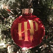 Harry Potter Ornament Made With A Diy Glitter Ornament And Cricut Vi Harry Potter Christmas Ornaments Harry Potter Christmas Harry Potter Christmas Decorations