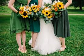 Bridesmaids In Green With Sunflower Bouquets In 2020 Dark Green Wedding Dark Green Bridesmaid Dress Wedding