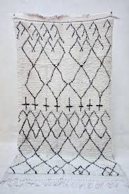 Black And White Moroccan Rug A Beni Ourain Rug To Add Warmth And Comfort To Your Space Now You Can Choose Your Ideal Size In A In 2020 Pink Rug White Moroccan Rugs Rugs On Carpet