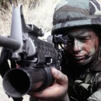 STAFF SGT. Manuel Segura, Space Command, aims an M-16A1 rifle equipped with  an M-203 grenade launcher during exercise Peacekeeper Challenge. Teams  representing the best of more than 50,000 Air Force security police