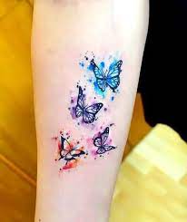 Watercolor Small Butterflies In Two Different Shades Drawn In Purple Blue And Orange Small Butterfly Tattoo Small Watercolor Tattoo Colour Tattoo For Women