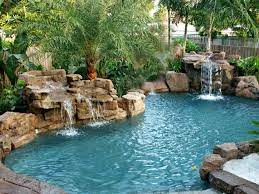 13 Eye Popping Fountains That Are Absolutely A Must For Every Garden Swimming Pool Waterfall Pool Landscaping Pool Waterfall