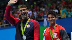 Singapore swimmer joseph schooling hugs opponent michael phelps, reacting to race results. Joseph Schooling What To Expect From The Michael Phelps Fanboy At The Tokyo Olympics