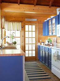 Fresh Maple Countertops And Cheery Blue Cabinets Make This Kitchen Unforgettable Http Www Bhg Com Knotty Pine Kitchen Pine Wood Walls Exposed Wood Ceilings