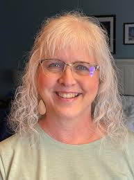 Hi. Can someone help me by making the background of this photo a dark tan  and changing the color.of.my shirt to a solid blue or something? Need it  for professional image. Pleaseeeee |