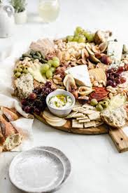 Sprinkle thyme leaves and place a sprig of time on top of the goat cheese and drizzle with olive oil. How To Make A Cheeseboard Broma Bakery
