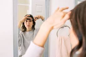 Trimming natural hair can be a complicated job, especially when you're trying to grow out your mane. How To Cut Your Own Hair At Home 3 Quick Tips From A Stylist