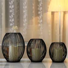 Candle holders are an easy way to elevate any room's decor. Wholesale Black Metal Candle Holder Simply Candle Stand Wedding Candlestick Candelabra Height 15 5 18 24cm Free Shipping Black Metal Candle Holder Wholesale Candelabracandelabra Wholesale Aliexpress