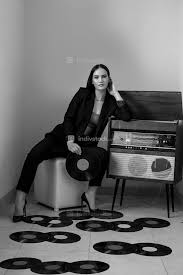 We did not find results for: A Beautiful Caucasian Young Woman In A Black Pantsuit And Black Sandals Poses Next To A Vintage Record Player With A Gramophone Record In Her Hands Black And White Image People