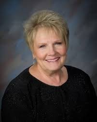 Dr. Norman directing the College of the Desert Choir, 1972/73. Not certain  where this is, might be the COD cafeteria; also might include choir members  from Dr. Norman's church choir. I recognize
