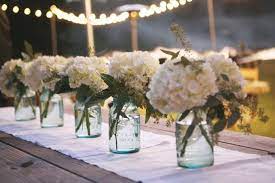 White Hydrangeas Seeded Eucalyptus In Mason Jars Ideas For C T Wedding Centerpieces Flower Centerpieces Wedding Mason Jar Hydrangea