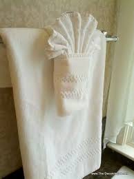 The Art Of Towel Folding The Karate Chopped Pillow The Decorologist Bathroom Towel Decor Fancy Towels How To Fold Towels