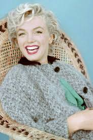 Marilyn. Wicker chair sitting. Photo by Milton Greene, 1954.