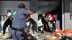 Metro police take aim on people who took part in a protest, at a shopping centre in soweto, near johannesburg tuesday july 13, 2021. Odyqed Ofcvjqm