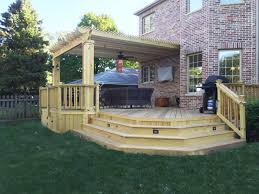 Construction of a new paver patio and pine pergola. Archadeck Outdoor Living Wood Deck Deck And Patio Combo Deck