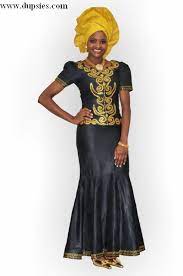 A gorgeous color combo, a black and gold dress is a welcome addition to any woman's closet. Pin By Aggie Wewer On Kelewele Traditional African Clothing African Clothing African Fashion