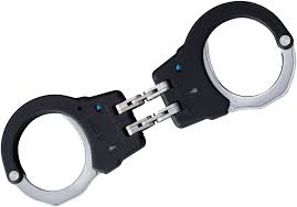 The most difficult handcuffed position to escape from with escape method explanation, hinged handcuffs, double locked, wrist out, behind back. Asp Black Steel 2 Pawl Hinge Handcuffs Blue Security Knifecenter 46111 Discontinued