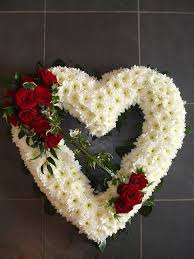 Funeral heart flower tributes at flower station. Open Heart Creative Flower Arrangements Funeral Flower Arrangements Funeral Floral