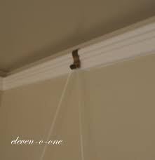 There are separate picture rail hooks made for hanging art on molding, so if you're going that route, be sure to choose the correct hardware. Hanging Pictures From A Molding Hook Picture Molding Home Design Decor Frugal Decor