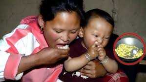 Mother & son ( Rita & ridam ) enjoying their dinner || Rita with her son  Ridam in buffalo shelter