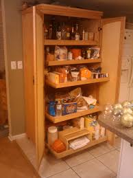 A total of 6 adjustable shelves are split by a large kitchen drawer. Wooden Kitchen Pantry Cabinet Home Architec Ideas