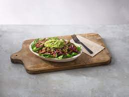 The line includes a keto salad lifestyle bowl that's filled with romaine lettuce, barbacoa, fajita veggies, green salsa, and guacamole. Chipotle Created New Bowls Specifically For Paleo Whole30 And Keto Diets