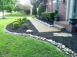 We have white rocks, put in by the previous owner of our home, in our front beds. Mulch And Stone Landscaping Ideas Flower Beds With Rocks Instead Of Mulch Beautiful River Rock Land Rock Garden Design Stone Landscaping Landscaping With Rocks