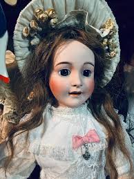 What is the age of a large heavy doll with "Paris 11"