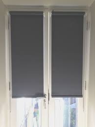 If you are wanting a blind for your door recess then a vertical blind with a split bunch option is ideal. Blackout Roller Blinds For French Doors Installed To Home In Wandsworth London Made In The Uk Made To M Blinds For French Doors Door Blinds Door Coverings