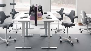 An ergonomic office chair that is well suited to work surfaces at different heights or to height adjustable desks; Hag Capisco Chair Ergonomic Office Seat Provides Multiple Active Sitting Options Gadget Flow