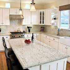 This impressive kitchen has a lot going on. 5 Granite Colors That Go Perfectly With White Cabinetry