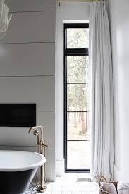 The space surrounding the freestanding tub makes the room feel more open, as does the lightweight curtain fabric, which allows maximum. Elegant Drapes In The Master Bathroom The House Of Silver Lining