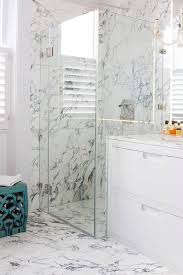 If you have windows in bathroom paint the frames white for matching the theme and tone of your bath space. White And Gray Marble Bathroom Floor Tiles Continue Into Shower Transitional Bathroom