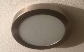 Drop ceiling fluorescent light covers are typically seen in commercial or institutional settings. How To Open Twist Off The Cover Of Some Really Stupid Awkward Flush Mounted Ceiling Light Dome Fittings Fixtures To Replace Change Light Bulb My Technical Blog