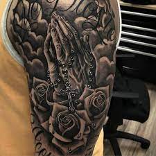A rosary and a wooden cross by the rib cage. 75 Hand Praying Tattoo Designs For Men Improb Praying Hands Tattoo Hand Tattoos For Guys Left Arm Tattoos
