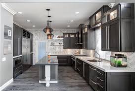 Since the light gray color of the island is quite similar to the wall color, compatibility value is also found in this design. White Kitchen With Dark Gray Floors Novocom Top