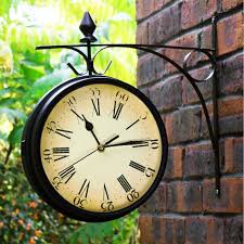 The lacy 14″ wrought iron wall clock is traditionally styled in wrought iron, finished in dark charcoal gray with silver edging. Garden Clocks Outdoor Waterproof Wrought Iron Vintage Decorative Double Sided Outdoor Clocks For The Garden Wall Mounted Battery Powered Metal Hanger Outside Clock Coffee Bar Round Station A Garden Outdoors Garden Decor