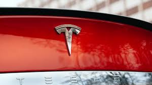 It's a white the tesla logo is a black background with a white letter t on it which represents the. Tsla Stock Up Size Of Tesla Stock And Bond Offering Increased