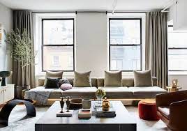 The designer chose the wooden coffee because it complements and contrasts the space's formal, traditional elements as well as the more modern ones. 23 Ways To Make Your Home Look More Expensive