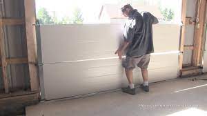Once you have the door reconnected, operate the garage door opener once or twice to make sure everything is running. How To Install A Garage Door Youtube