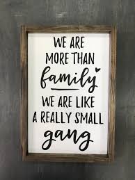 We Are More Than Family We Are Like A Really Small Gang Funny Home Signs Funny Family Signs Famil Family Room Wall Decor Family Room Walls Family Signs