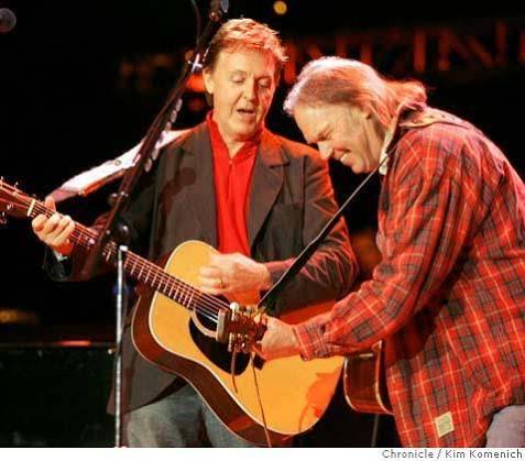 Paul McCartney performs with Neil Young.