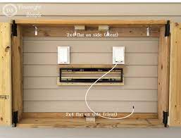 Open cubbies on the bottom keep everything in plain sight and right at your fingertips. Downright Simple Outdoor Tv Cabinet