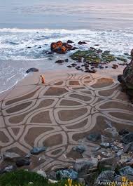With His Trusty Rake Andres Amador Combs Intricate Designs In The Sanfran Beaches Stunning Sand Art Beach Art Land Art