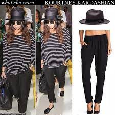 What She Wore Kourtney Kardashian In Stripe Top Black Pants With Black Straw Hat At Lax On March 13 Outfits With Hats Straw Hats Outfit Black Straw Hat