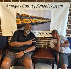 Fred Pemberton Sr. joined the Douglas County School System Transportation  Department in 2021 with the goal of driving his own kids to school. 🚌 He  and his son, Fred Jr., share a