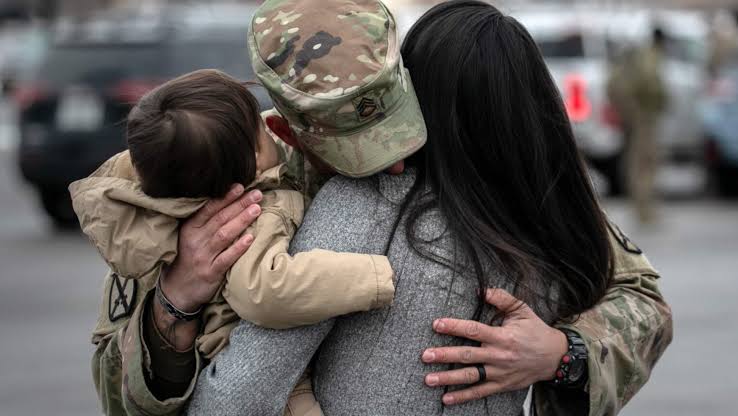A U.S. military service member preparing for duty, highlighting the new fertility support initiative.