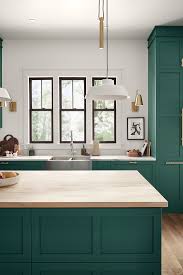 Beautiful paint color on the cabinetry! These Painted Kitchen Cabinets Are A Rich Emerald Green That Is Accented B Green Kitchen Cabinets Painted Kitchen Cabinets Colors Hgtv Home By Sherwin Williams