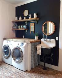 The space boasts two washers and dryers, amplifying counter space for sorting through clothes and folding towels with ease. Navy Blue Laundry Room Walls Novocom Top